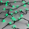 Миниатюра фото гирлянда «шарики» 10м зеленая 220в, диаметр шарика 23мм, 100 led, провод черный каучук 2,3мм, ip54 ltc pcs-100b-g | 220svet.ru